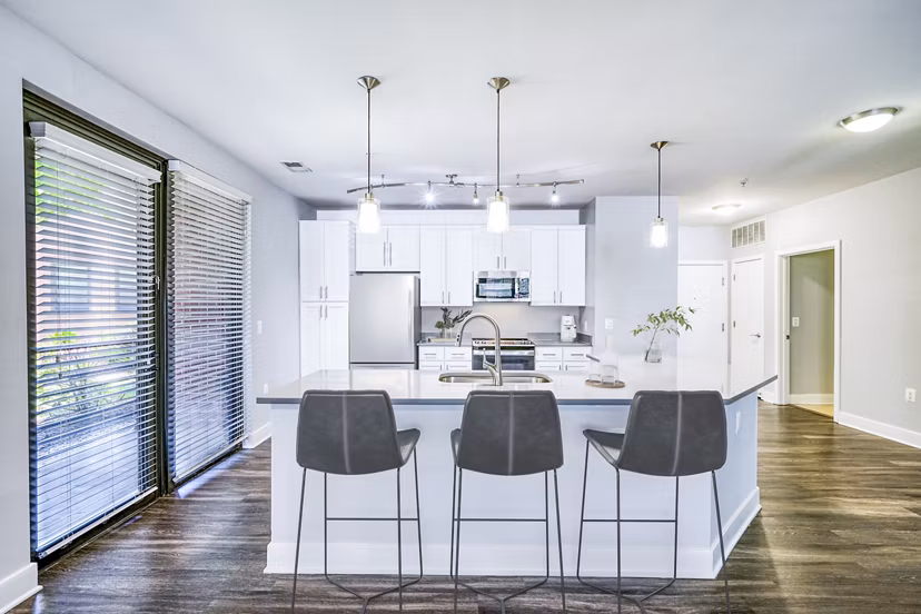 Dining area with modern furnishings at Del Ray Central Apartments, featuring sleek design and ample seating options in Washington, DC