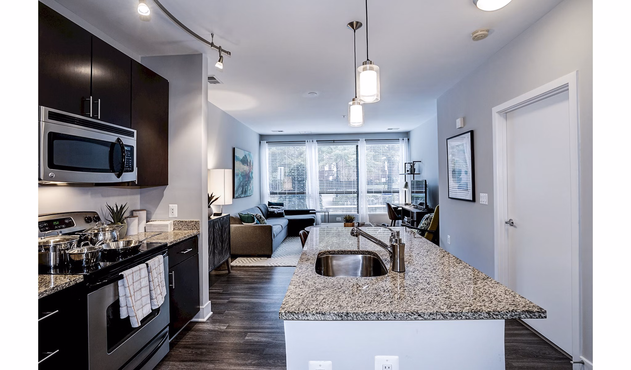Modern kitchen with stainless steel appliances at Del Ray Central Apartments