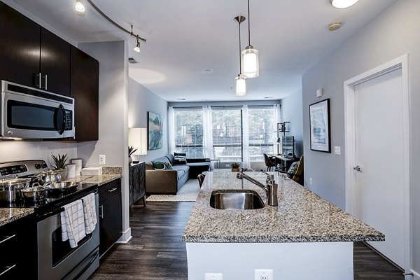 Modern kitchen with stainless steel appliances at Del Ray Central Apartments