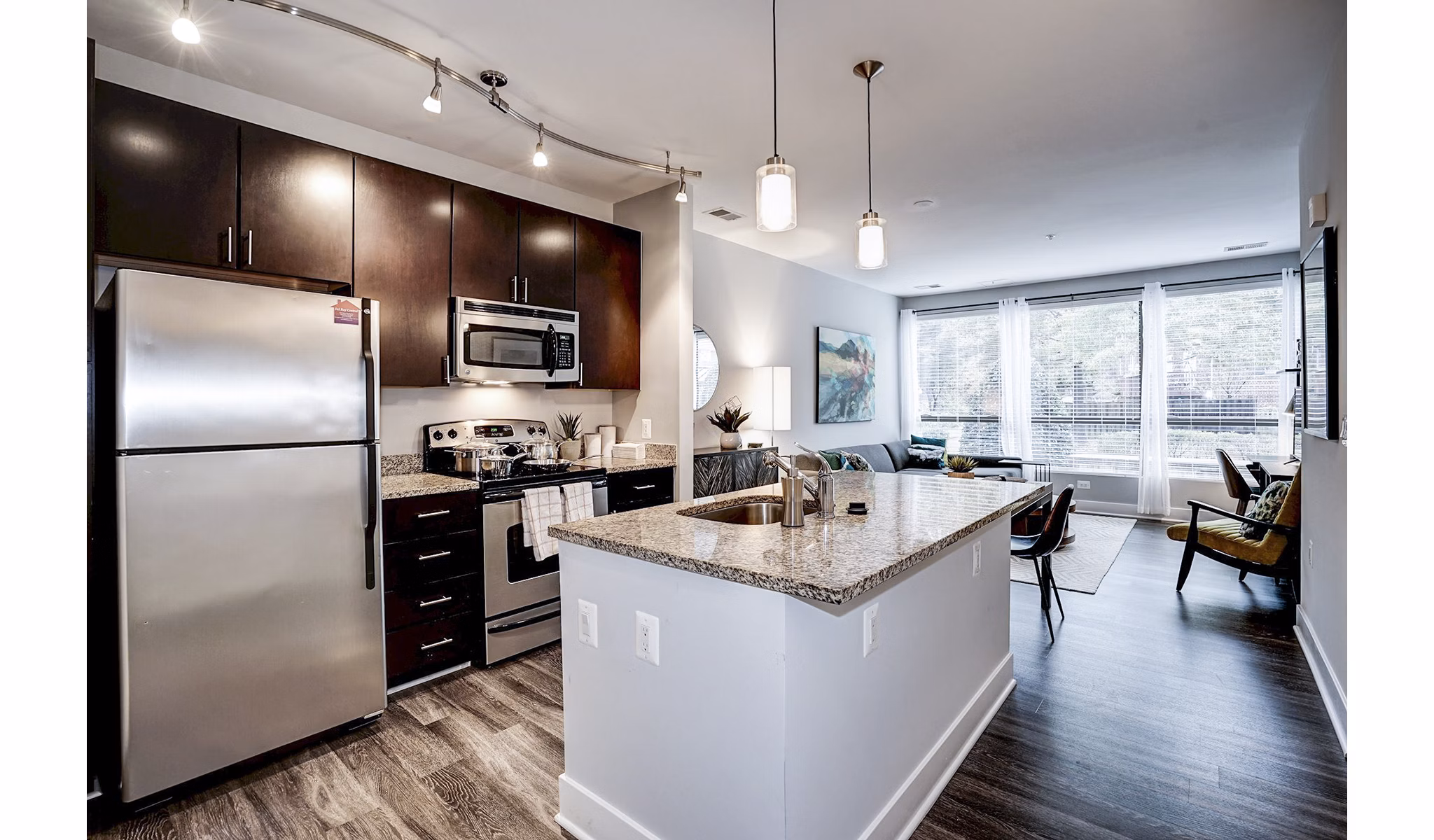 Modern kitchen with stainless steel appliances at Del Ray Central Apartments perfect for culinary enthusiasts