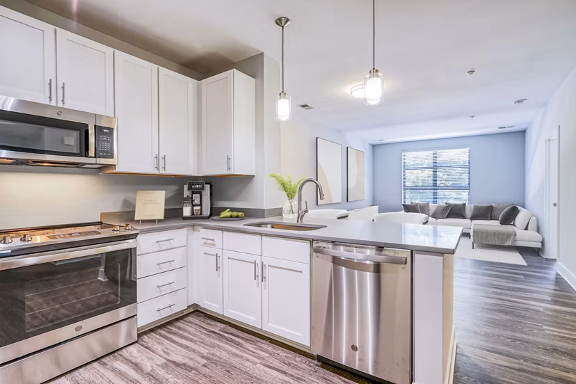 Contemporary kitchen with modern appliances at Del Ray Central Apartments