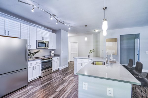 Modern kitchen with stainless steel appliances at Del Ray Central Apartments