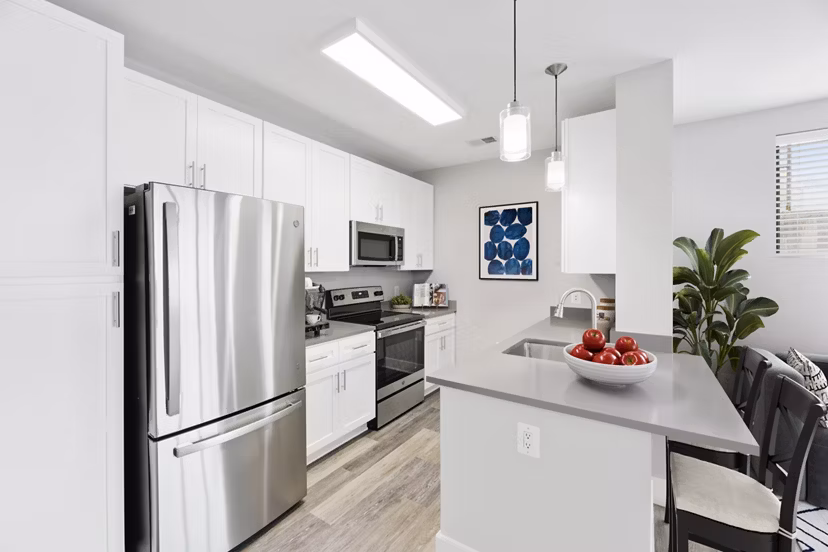 Modern kitchen with stainless steel appliances at Del Ray Central Apartments