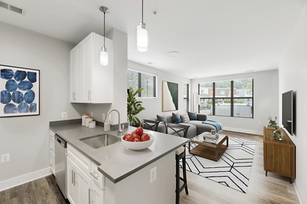 Modern kitchen with stainless steel appliances at Del Ray Central Apartments