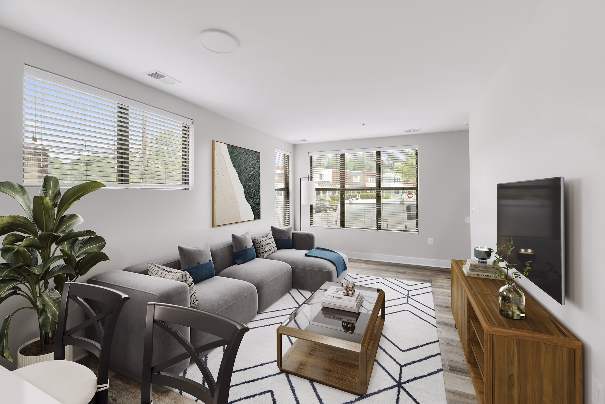 Spacious living room with modern decor in Del Ray Central Apartments