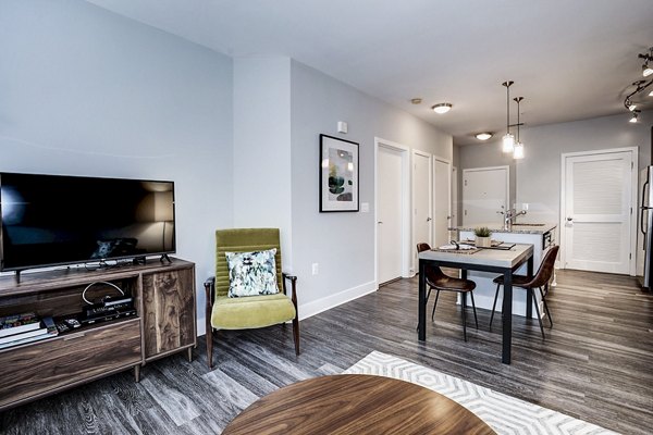 Spacious living room with modern furnishings and natural light in Del Ray Central Apartments