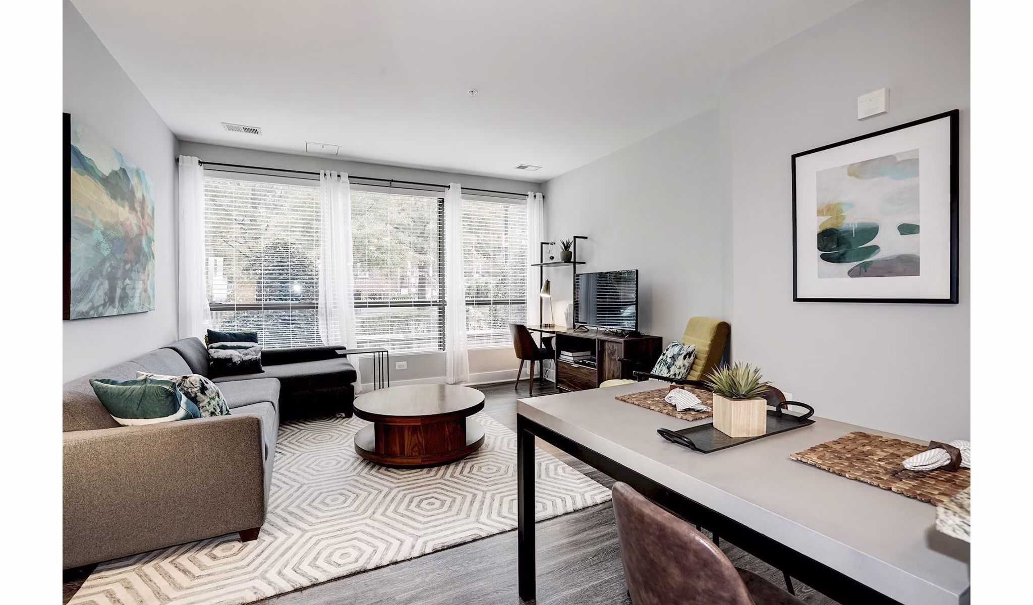 Spacious living room with modern furnishings and natural light at Del Ray Central Apartments