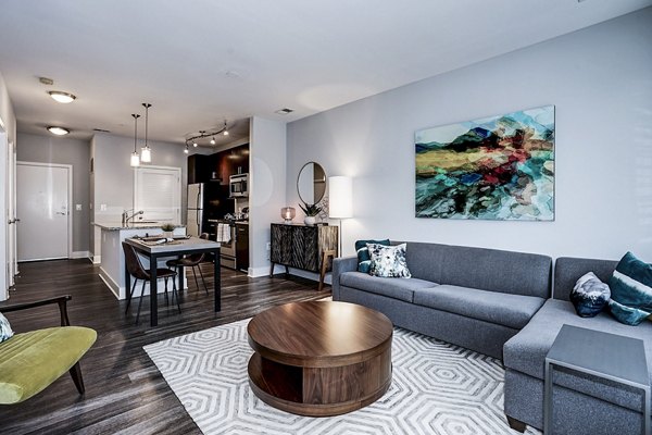 Spacious living room with modern decor in Del Ray Central Apartments