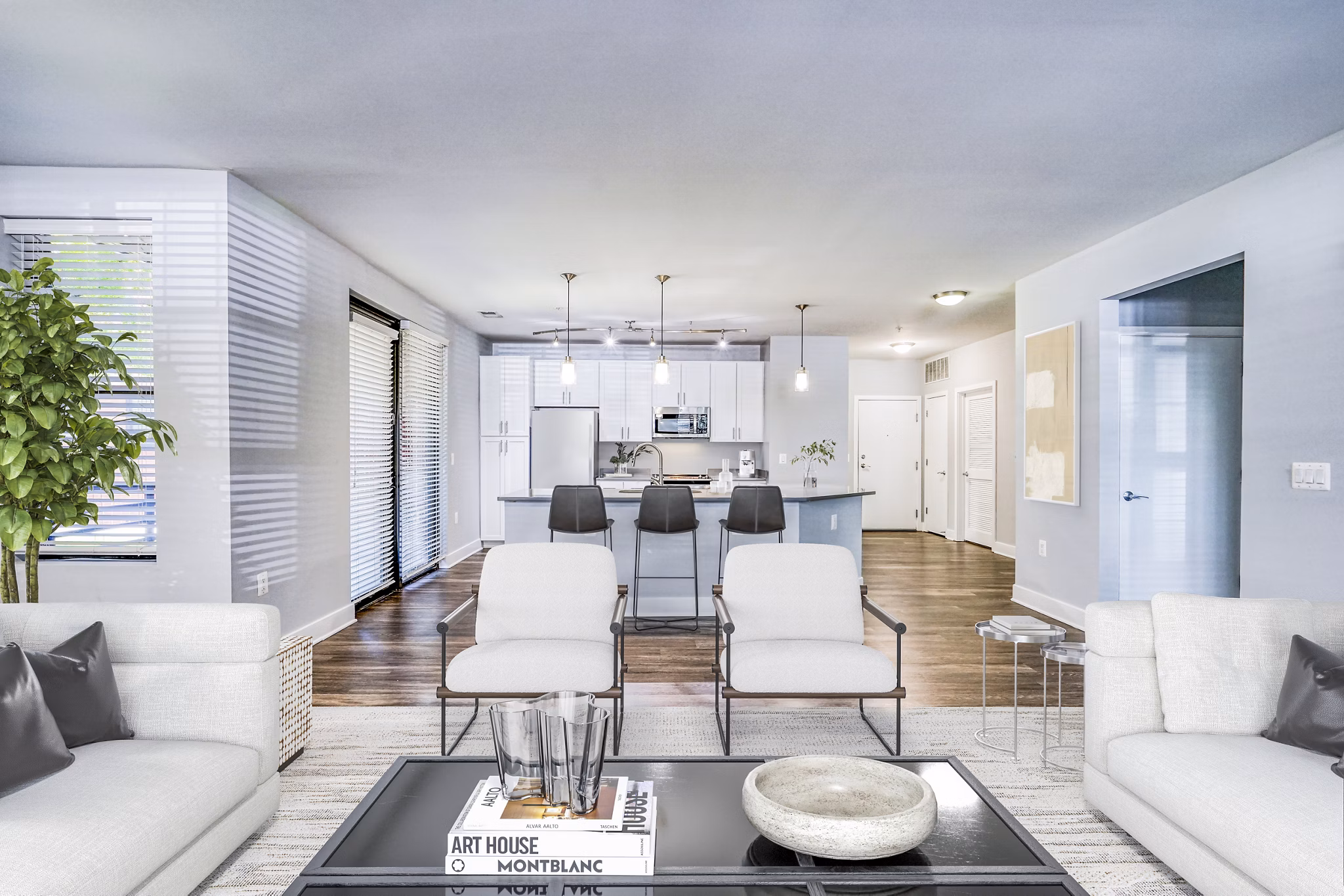 Contemporary living room with cozy seating and large windows at Del Ray Central Apartments, ideal for luxury living in a vibrant community