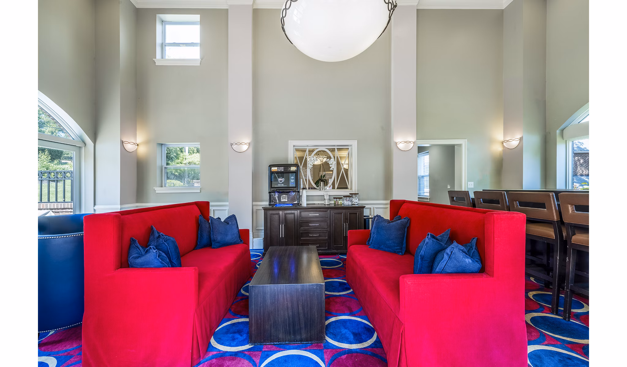 Clubhouse featuring a cozy lounge area at Village at Fox Point Apartments