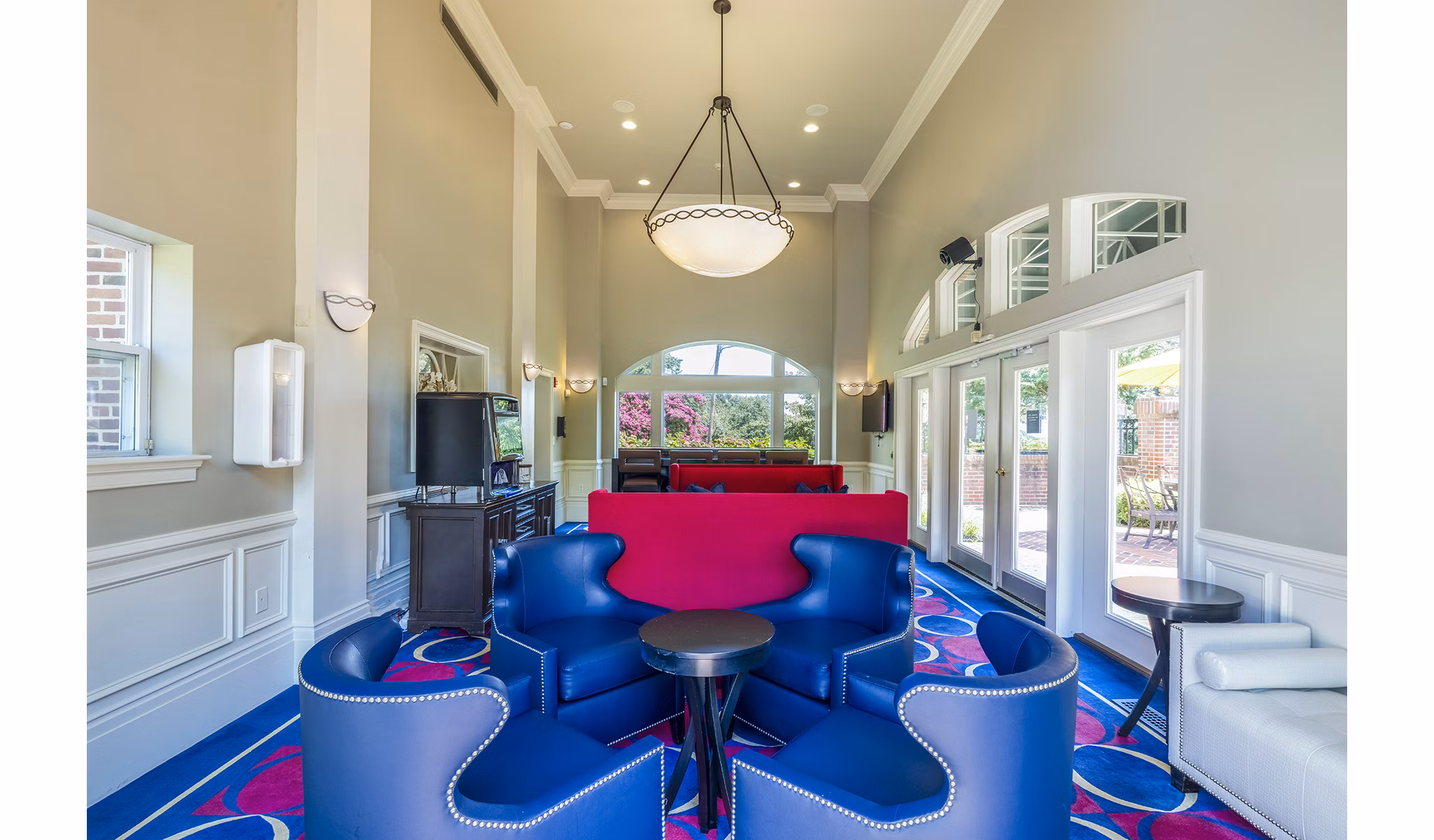Clubhouse featuring modern design and cozy seating at Village at Fox Point Apartments