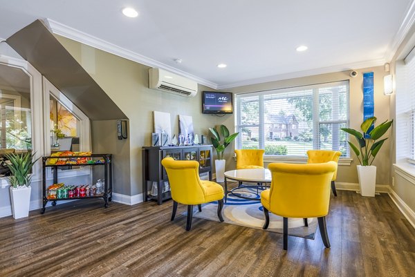 Elegant clubhouse featuring cozy seating and modern decor at Village at Fox Point Apartments