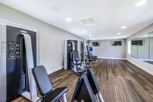 Fitness center with modern equipment at Village at Fox Point Apartments, perfect for residents seeking a healthy lifestyle