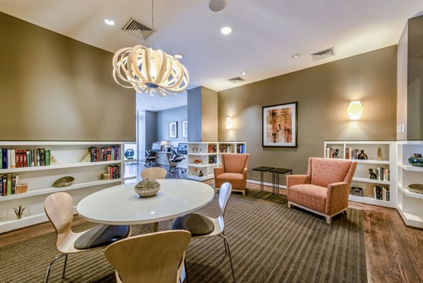 Modern dining area with round table and stylish chairs in luxury apartment