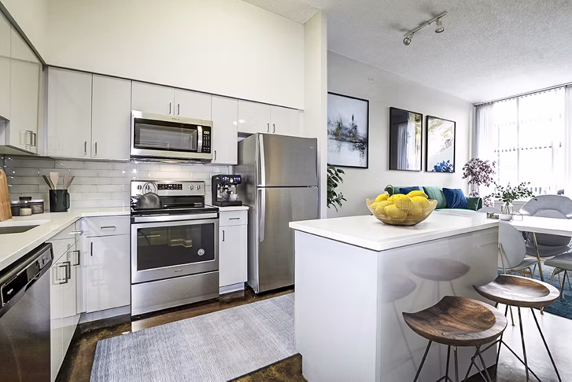 Modern kitchen with stainless steel appliances at Massachusetts Court Apartments