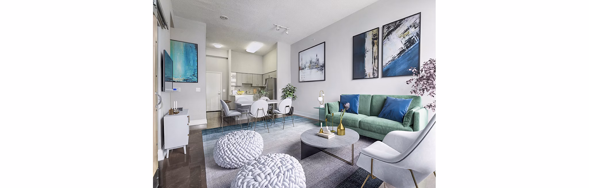 Spacious living room with sleek furniture and natural light in Massachusetts Court Apartments