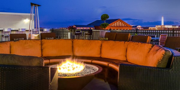 Fire pit lounge area with cozy seating at Massachusetts Court Apartments, a Greystar luxury community in Washington, DC