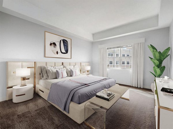 Spacious bedroom with elegant decor at The Hawthorne Apartments