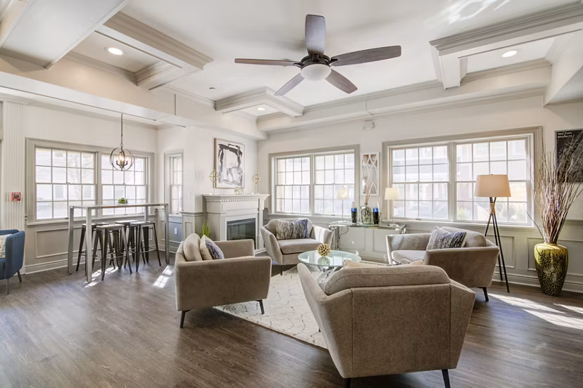 Clubhouse with modern design and cozy seating at The Hawthorne Apartments