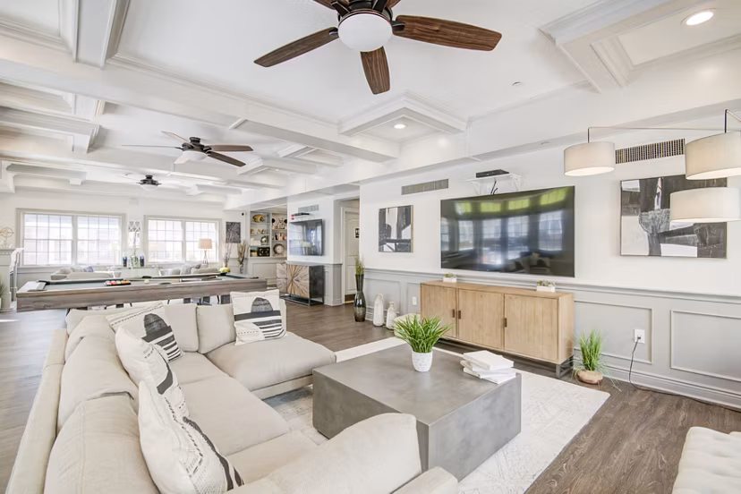 Clubhouse featuring modern design and cozy seating areas at The Hawthorne Apartments, a Greystar luxury community in Valley Stream, NY.