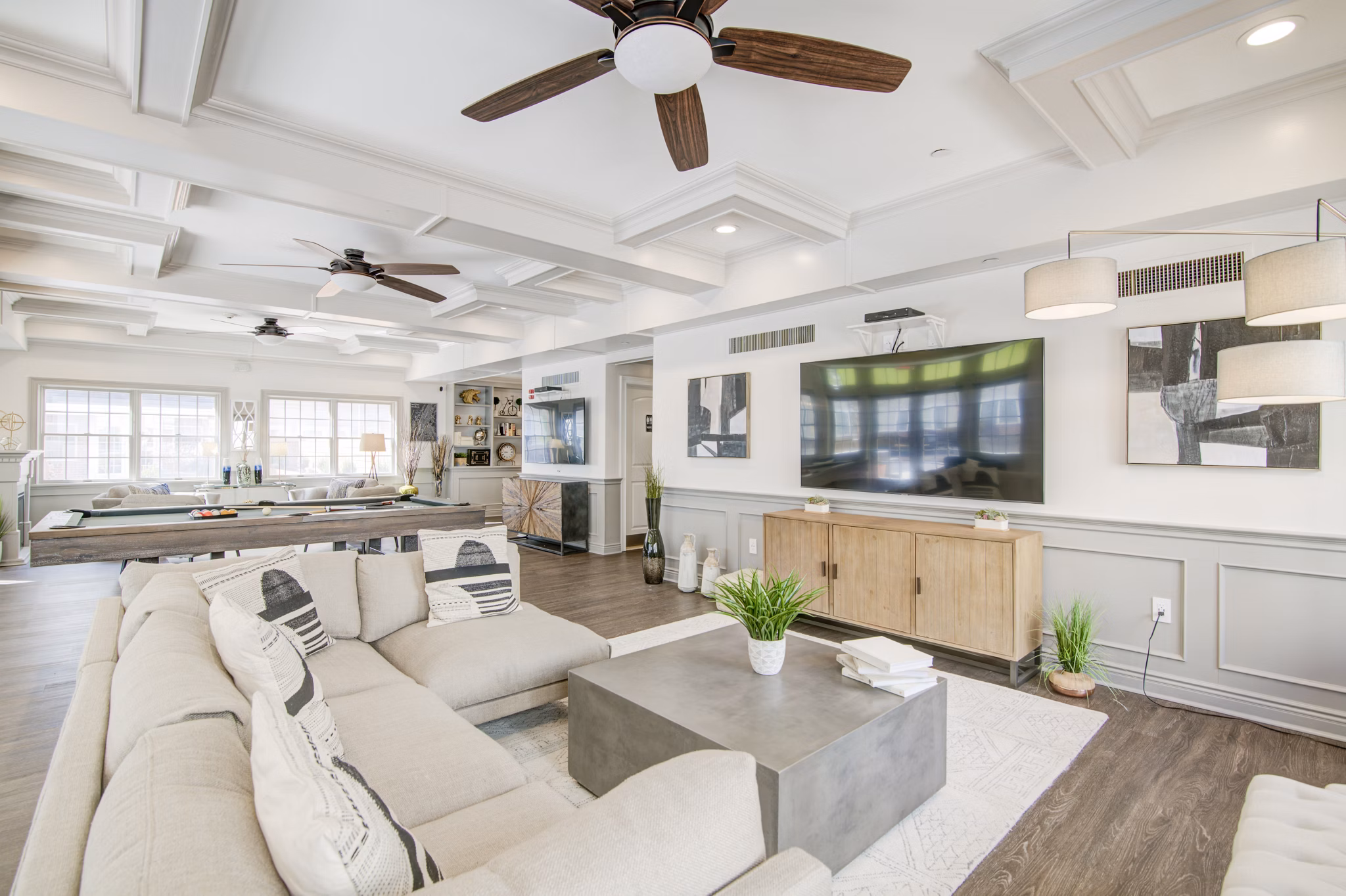 Clubhouse featuring modern design and cozy seating areas at The Hawthorne Apartments, a Greystar luxury community in Valley Stream, NY.