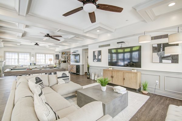 Clubhouse featuring modern design and cozy seating areas at The Hawthorne Apartments, a Greystar luxury community in Valley Stream, NY.