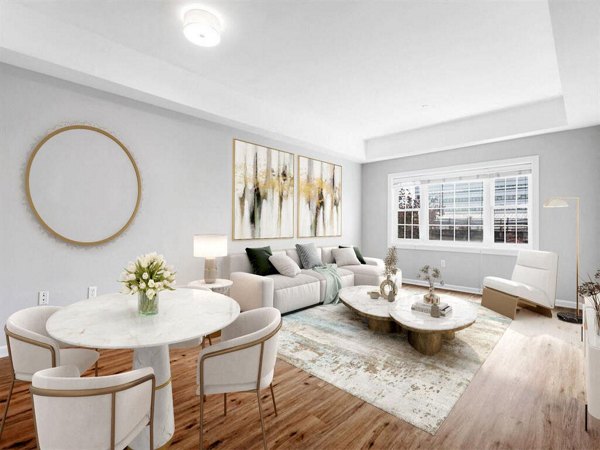 Dining area featuring modern furnishings and natural light at The Hawthorne Apartments
