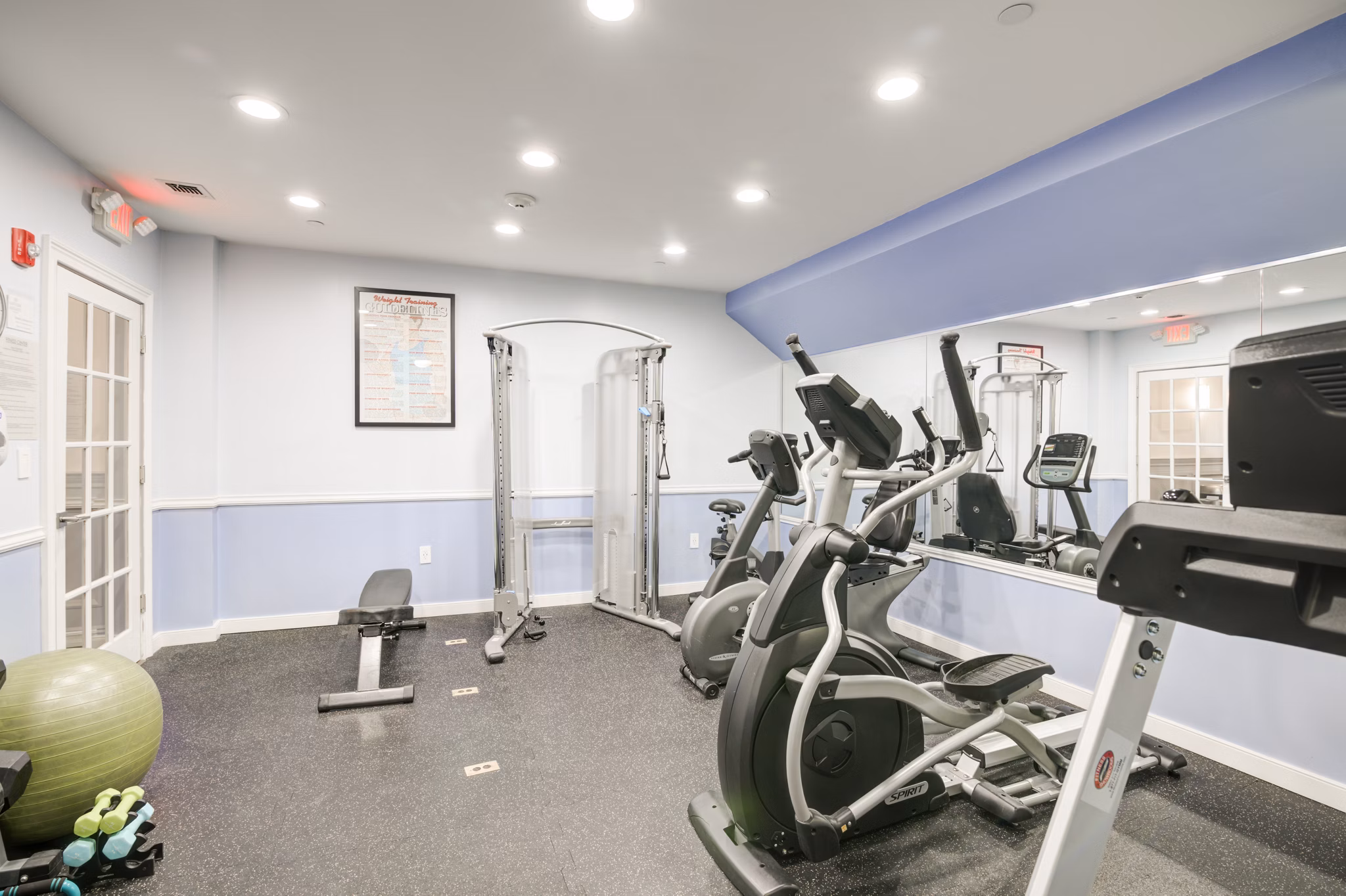 State-of-the-art fitness center with modern equipment at The Hawthorne Apartments