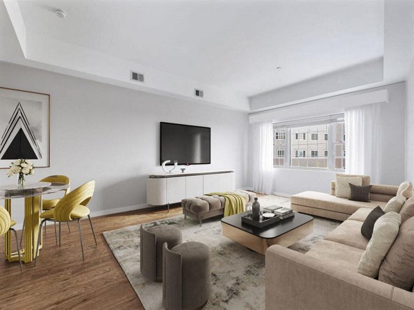 Spacious living room featuring modern decor and natural light at The Hawthorne Apartments