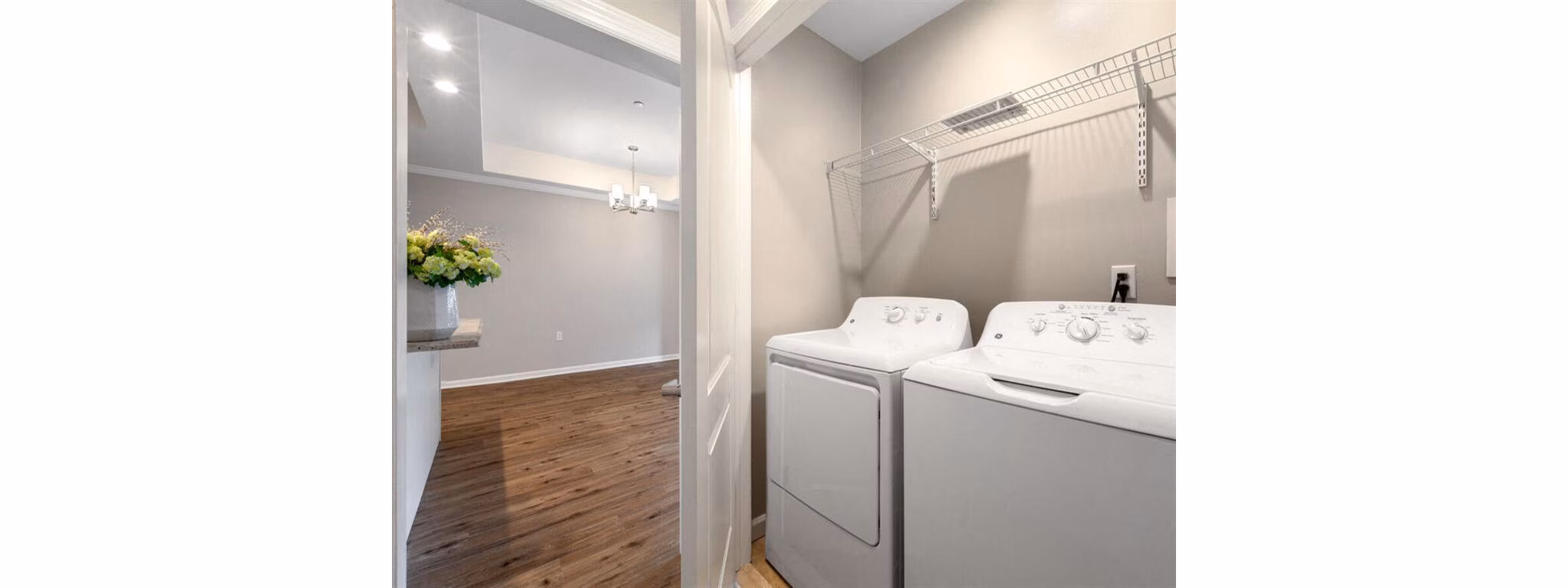 Laundry room with modern appliances at The Hawthorne Apartments