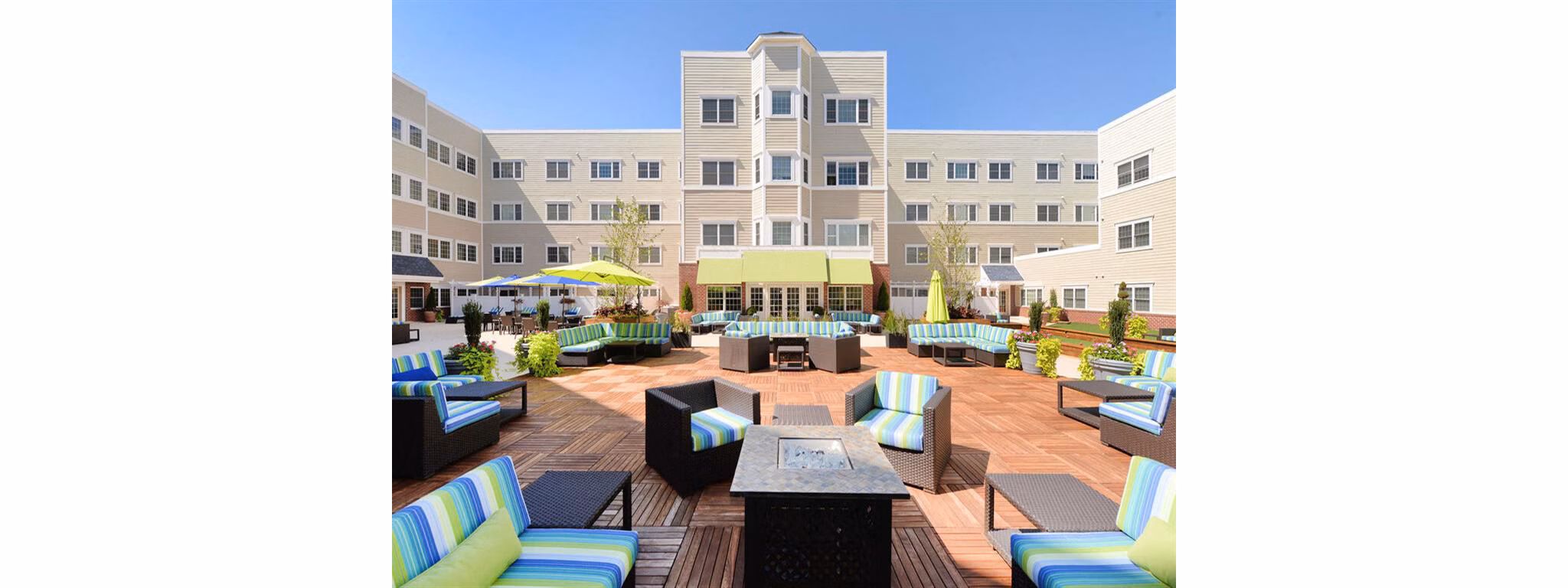 Fire pit lounge area with cozy seating at The Hawthorne Apartments, a luxury living community
