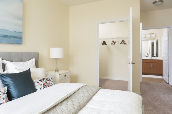 Modern bedroom with stylish decor at The Prescott, luxury apartments in Concord