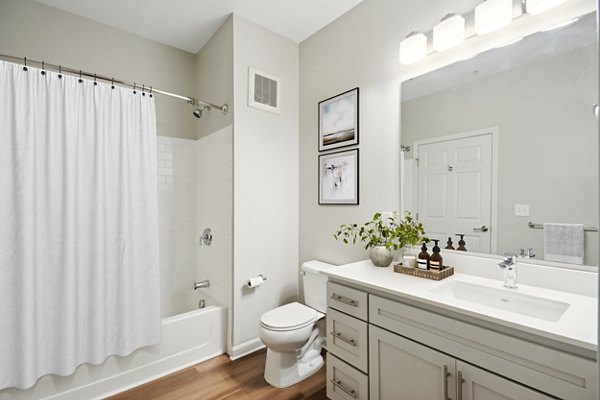 Contemporary bathroom featuring sleek fixtures at The Prescott at Concord Apartments, offering luxury living