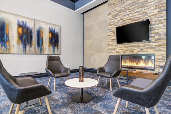 Elegant clubhouse featuring modern design at The Prescott at Concord Apartments, perfect for luxury living and gatherings