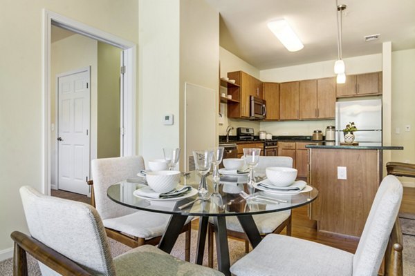 Dining area featuring modern decor and natural lighting at The Prescott at Concord Apartments