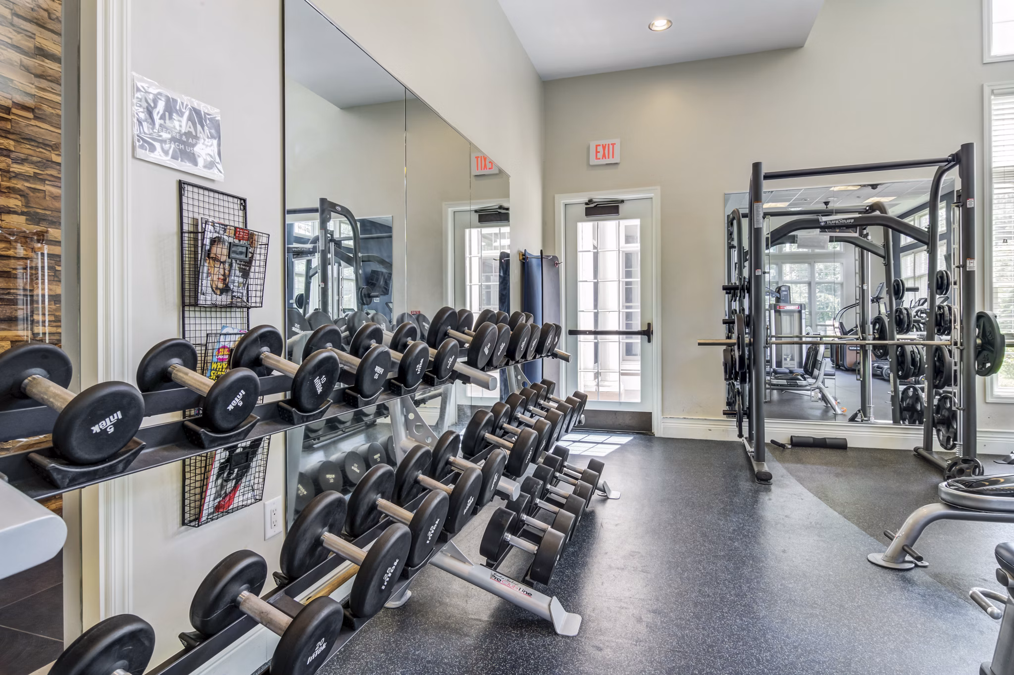 Modern fitness center with state-of-the-art equipment at The Prescott at Concord Apartments
