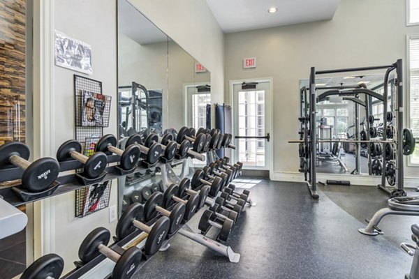 Modern fitness center with state-of-the-art equipment at The Prescott at Concord Apartments