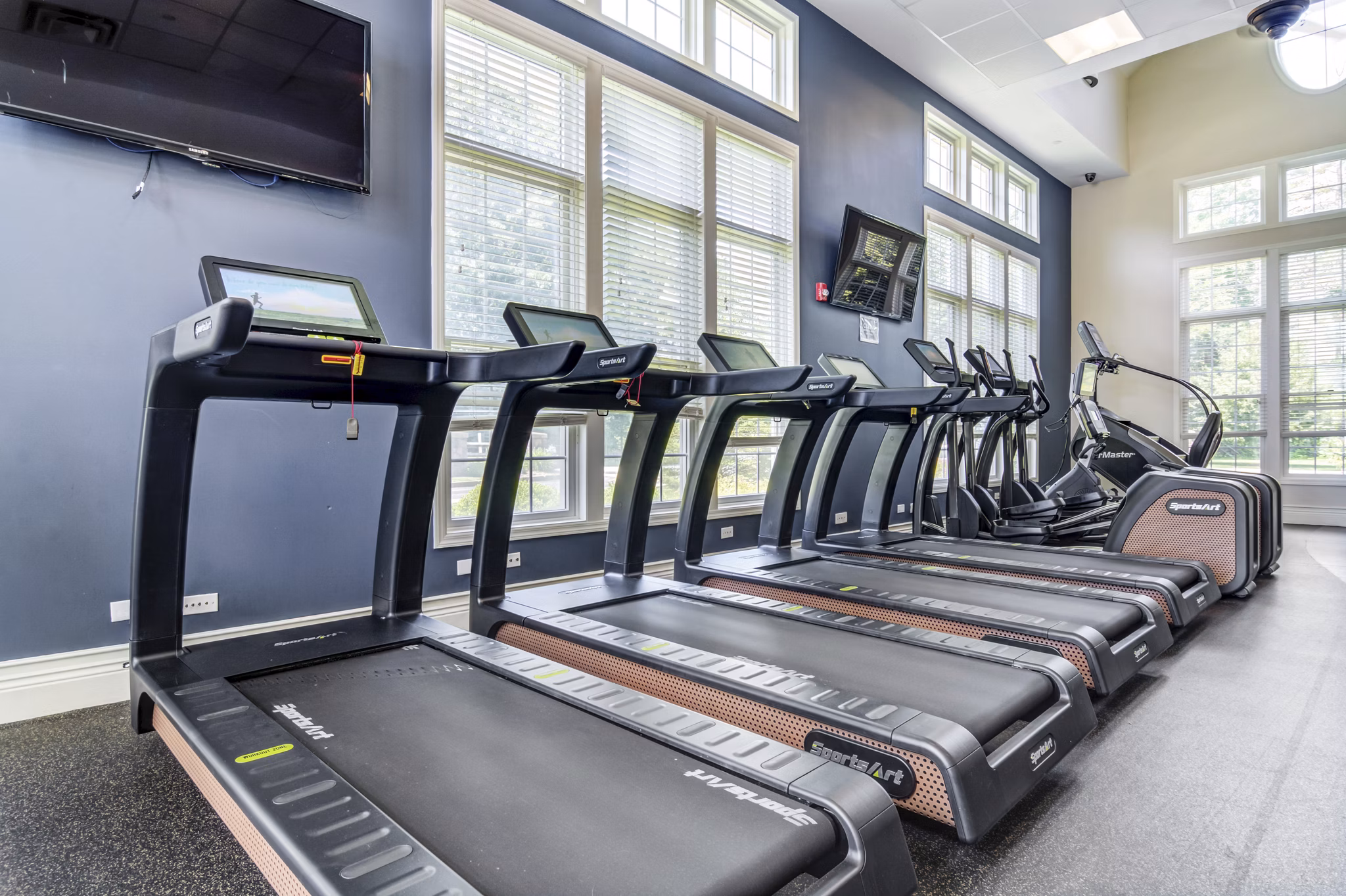 State-of-the-art fitness center with modern equipment at The Prescott at Concord Apartments