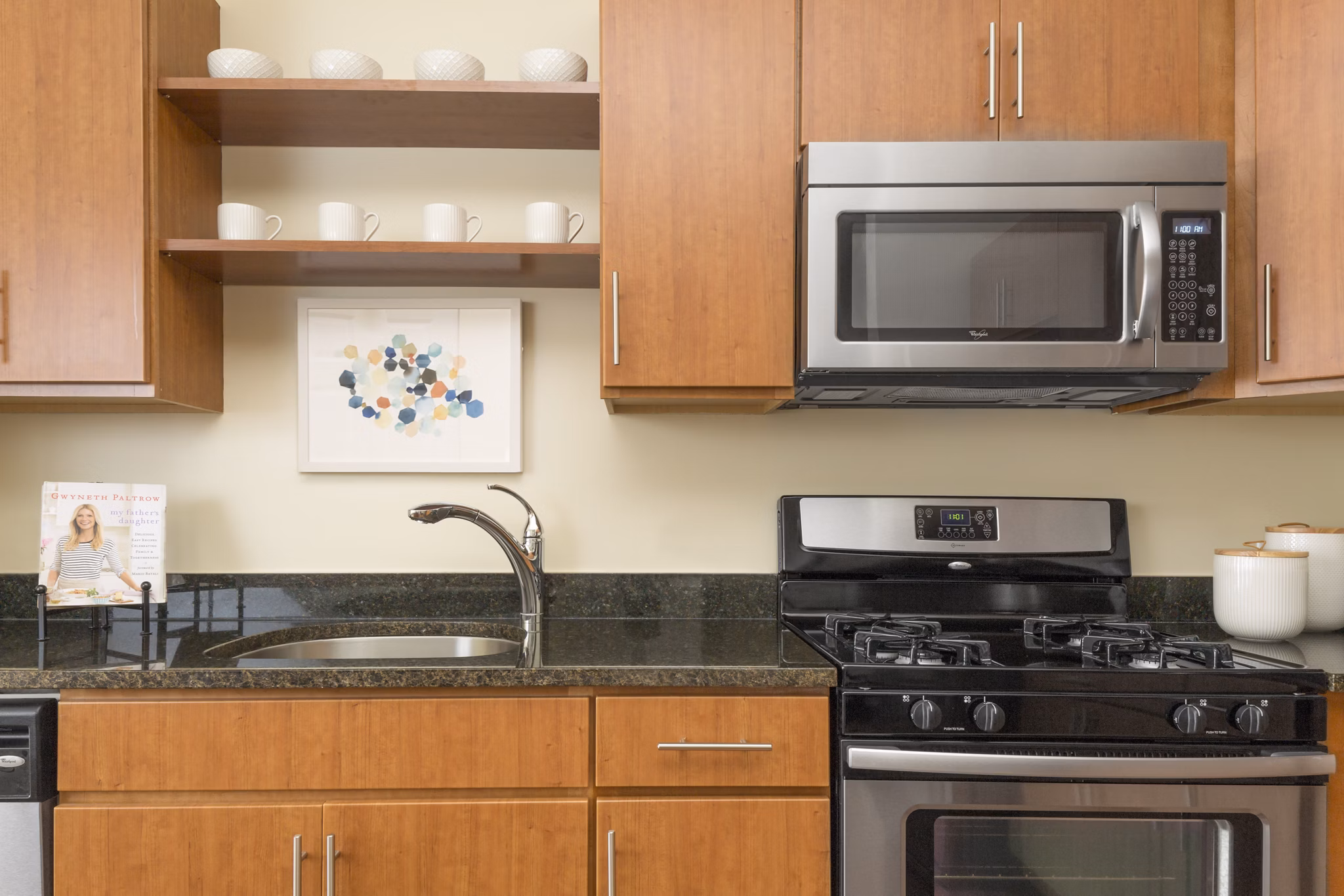 Modern kitchen with stainless steel appliances at The Prescott at Concord Apartments