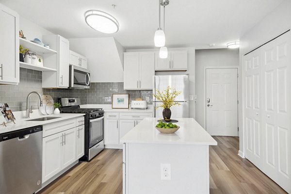 Modern kitchen with stainless steel appliances at The Prescott at Concord Apartments