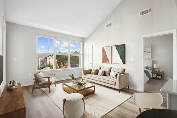 Open-concept living room with elegant decor at The Prescott at Concord Apartments