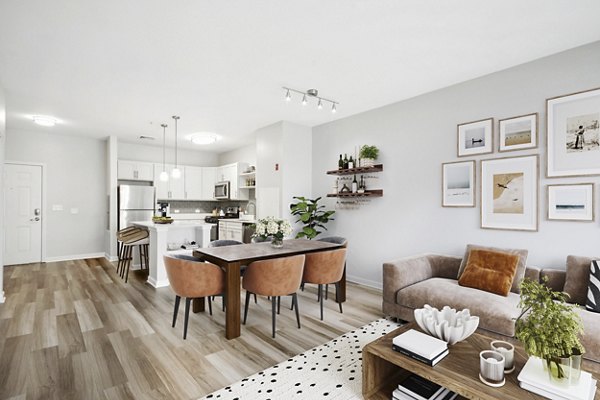 Cozy living room with modern decor at The Prescott at Concord Apartments