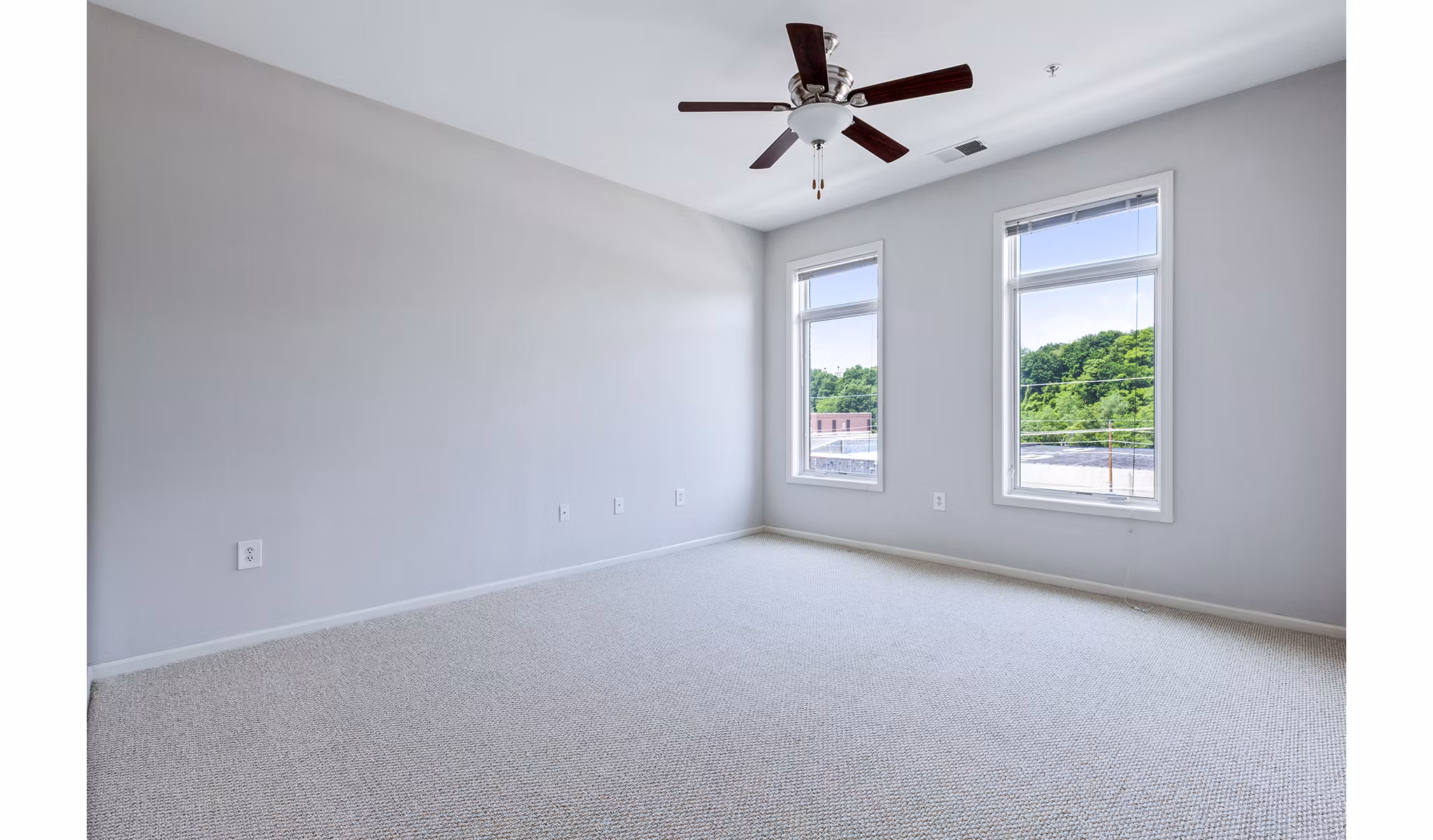 Modern bedroom with elegant decor at 1000 Jefferson Street Apartments