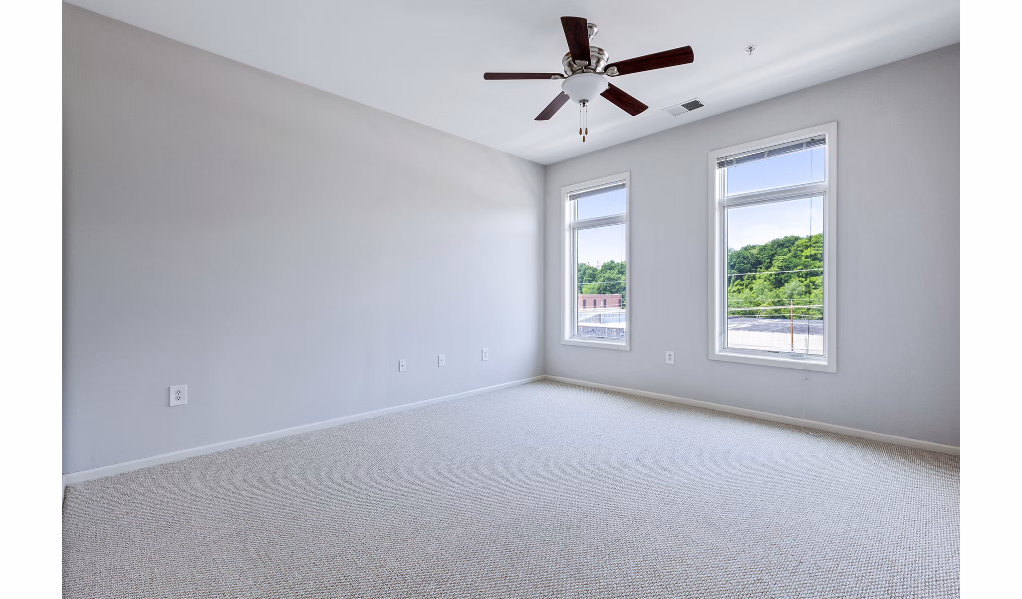 Modern bedroom with elegant decor at 1000 Jefferson Street Apartments