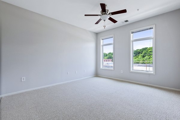 Modern bedroom with elegant decor at 1000 Jefferson Street Apartments