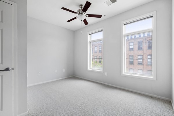 Spacious bedroom with modern decor at 1000 Jefferson Street Apartments