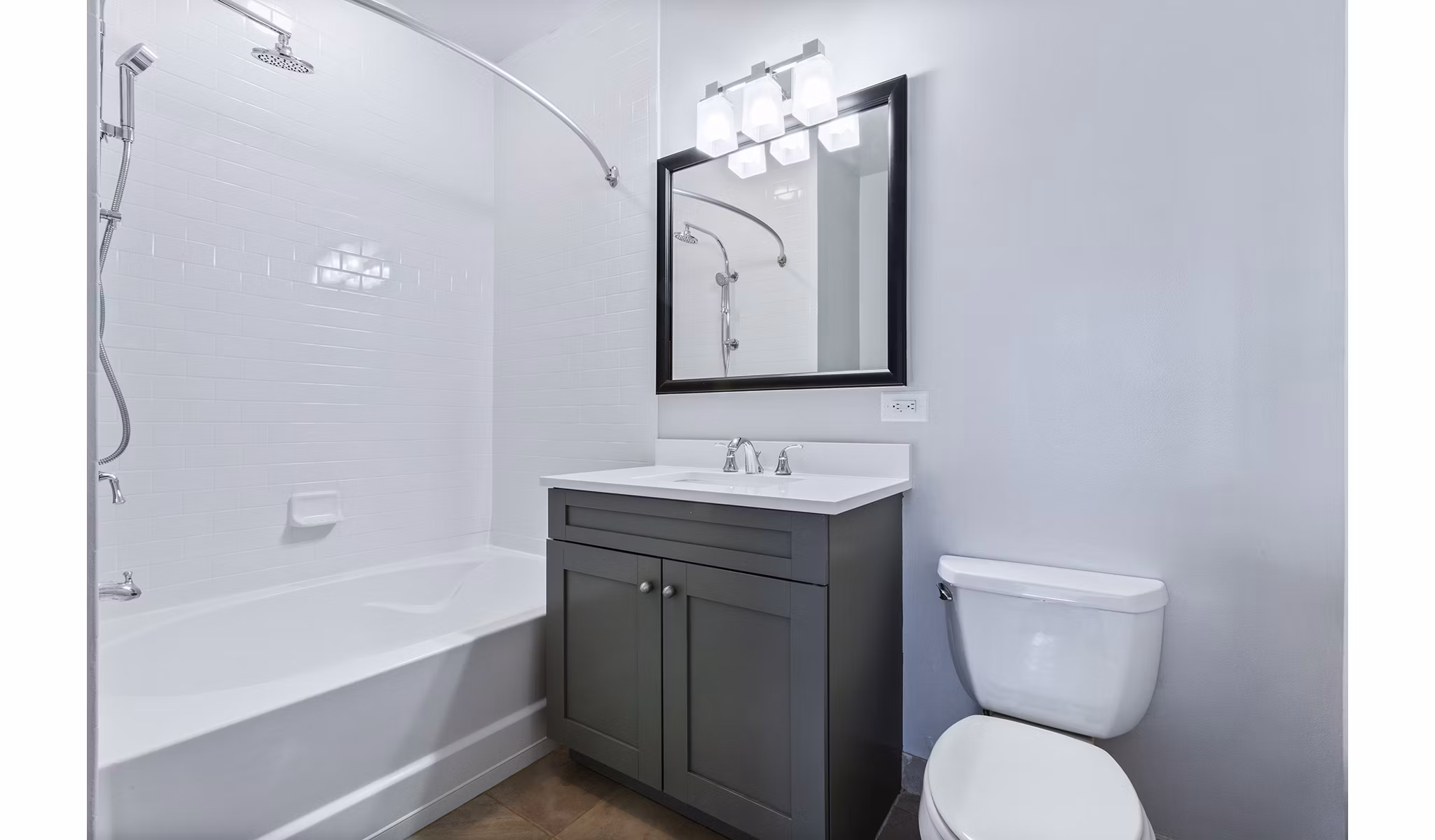 Bathroom featuring sleek finishes and modern fixtures at 1000 Jefferson Street Apartments