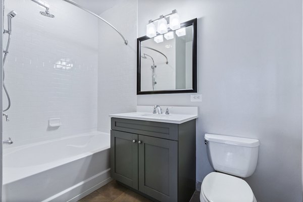 Bathroom featuring sleek finishes and modern fixtures at 1000 Jefferson Street Apartments