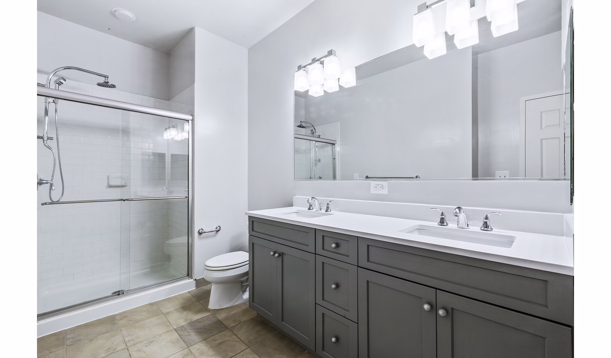 Elegant bathroom with marble countertops and modern fixtures at 1000 Jefferson Street Apartments
