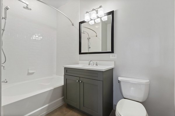 Luxurious bathroom with modern fixtures at 1000 Jefferson Street Apartments